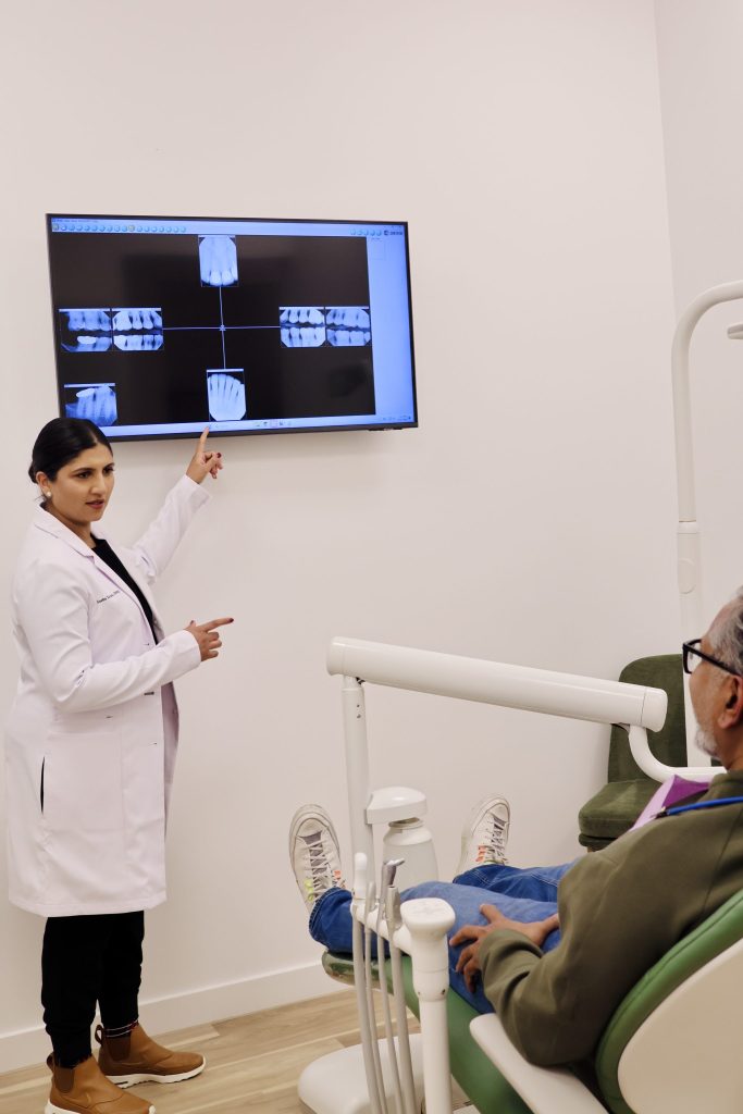 Dr. Xavier with a patient at Dept of Smiles