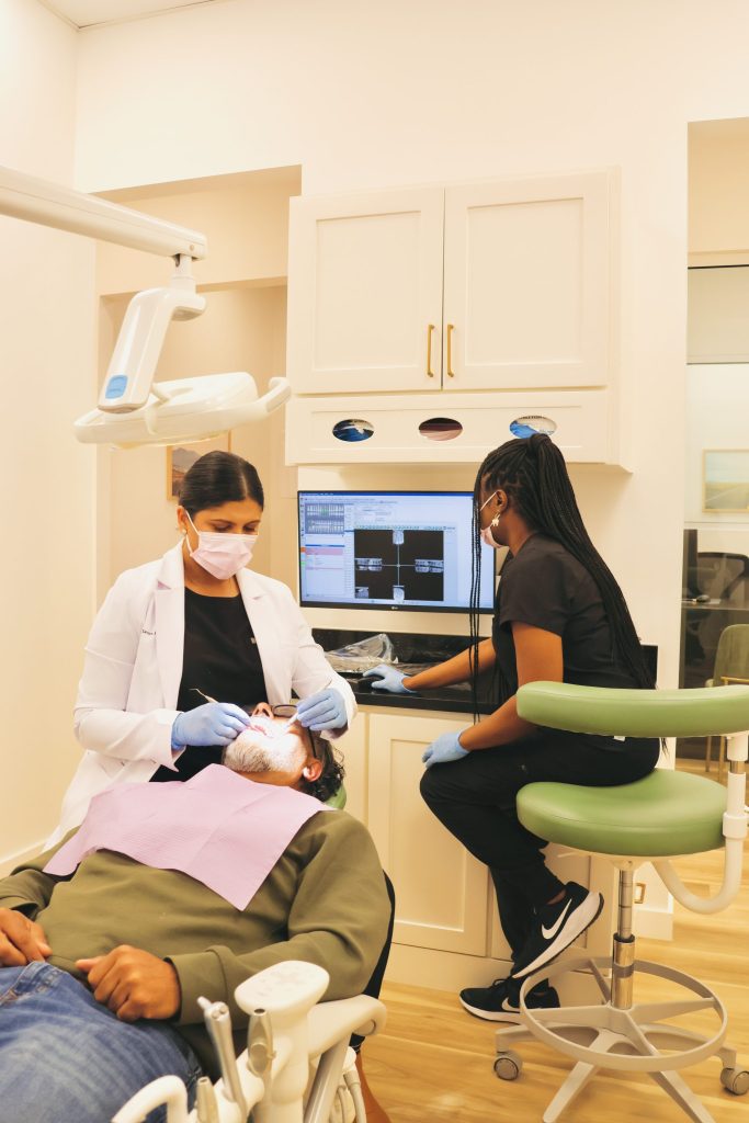 Dept of Smiles Pearland Dr Sneha Xavier with a patient