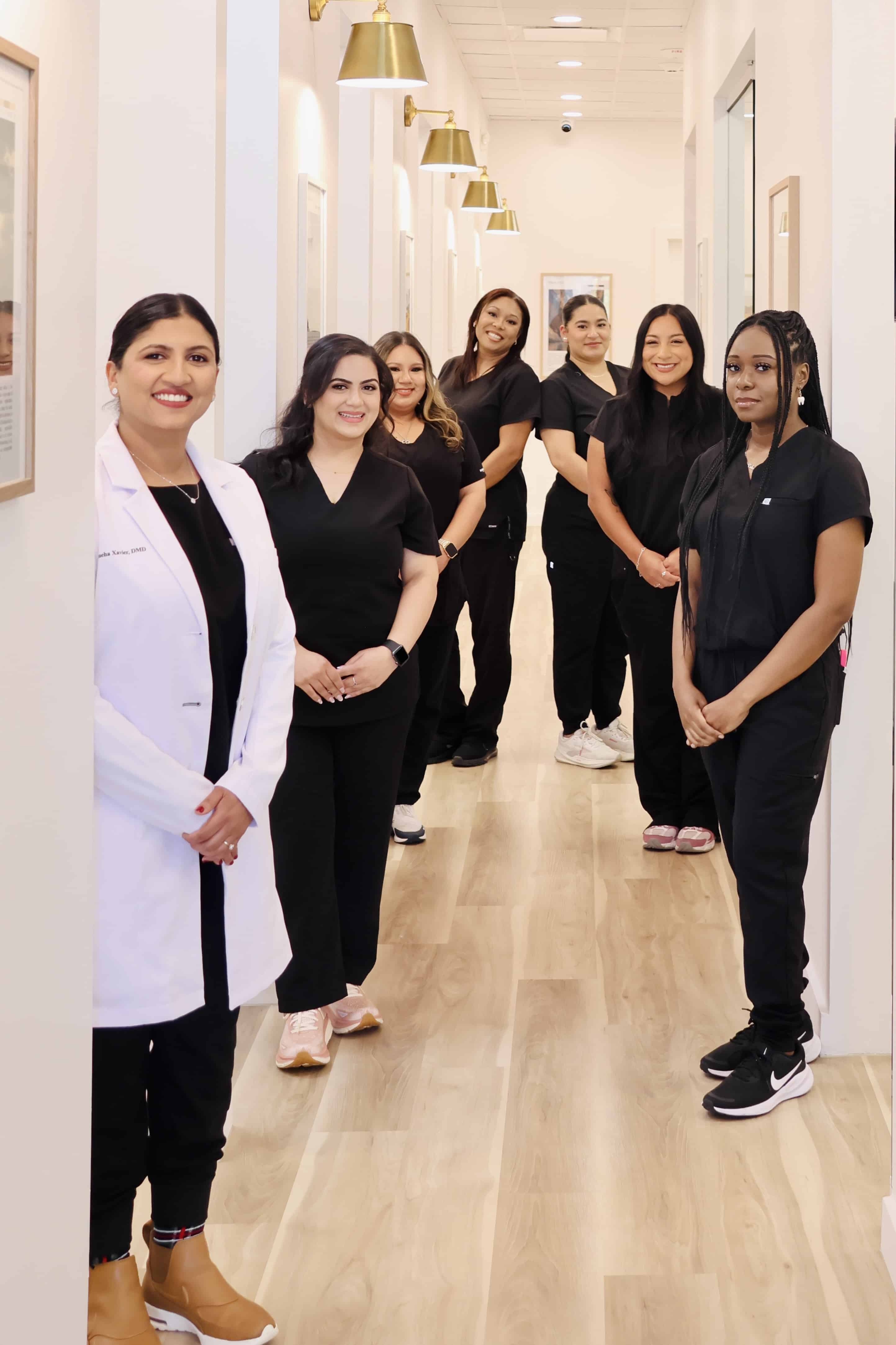 Dr. Sneha Xavier and Dept. of Smiles team providing ceramic crown treatment in Pearland, TX