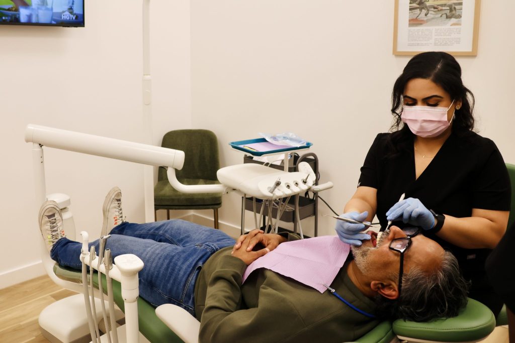 Patient receiving family dental care at Dept. of Smiles in Pearland, TX